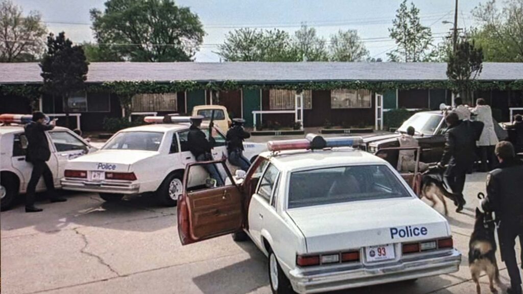 Police at Foothills motel Wisdom movie still