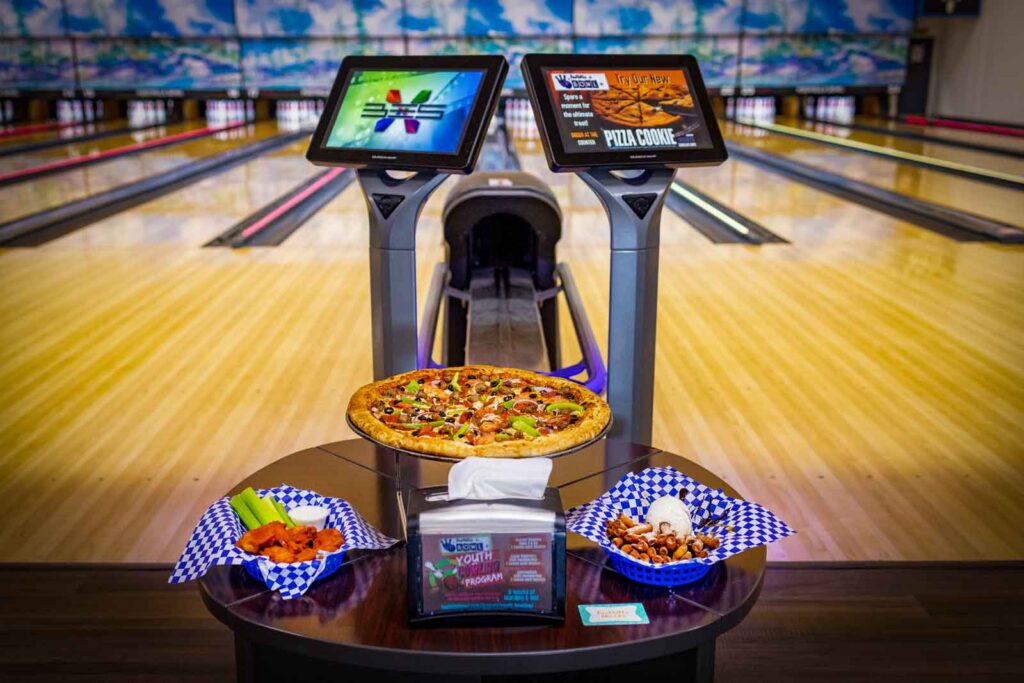Bowling lanes with restaurant food.